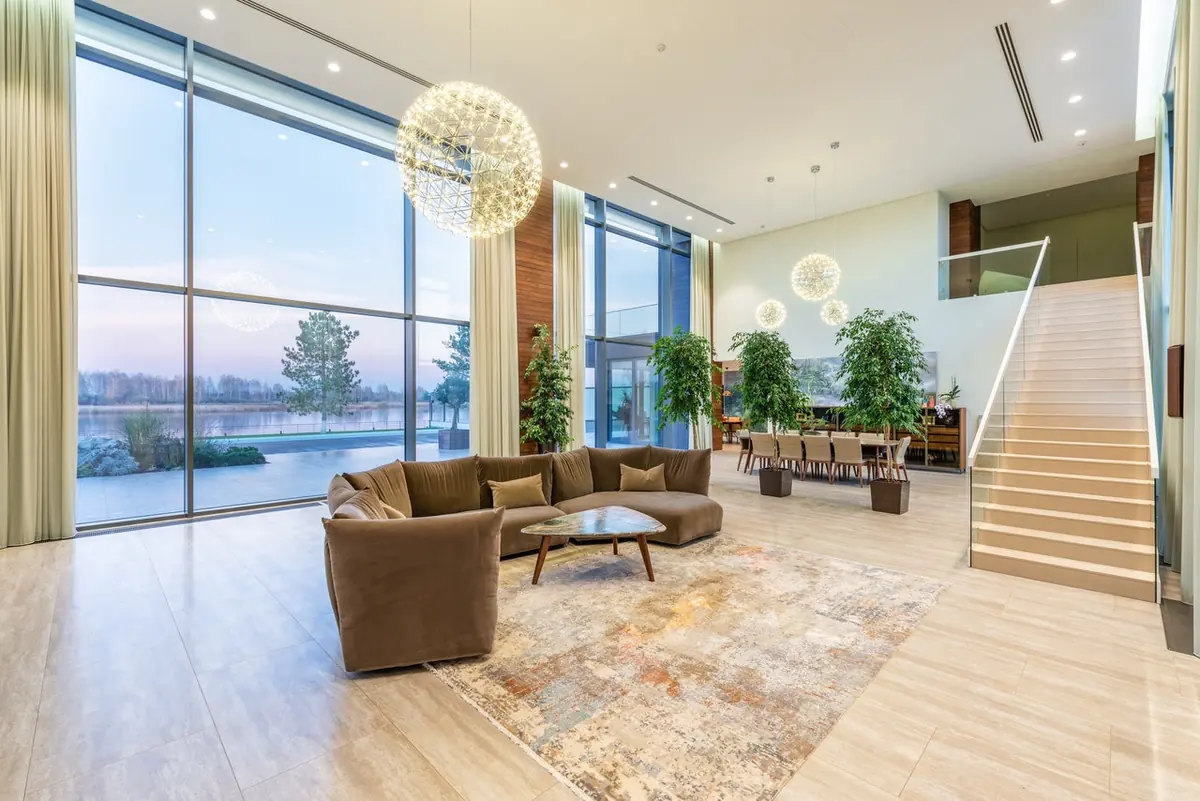 A modern living room with light oak flooring