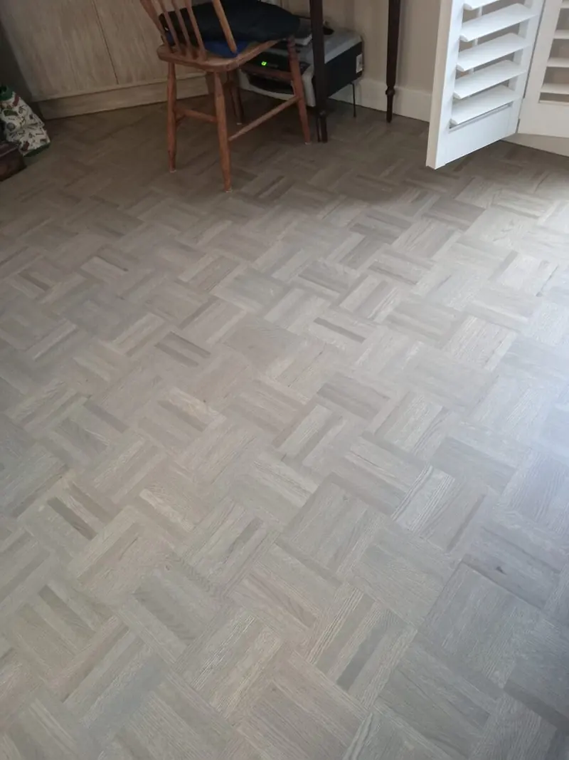 Refinished parquet floor in a custom grey stain